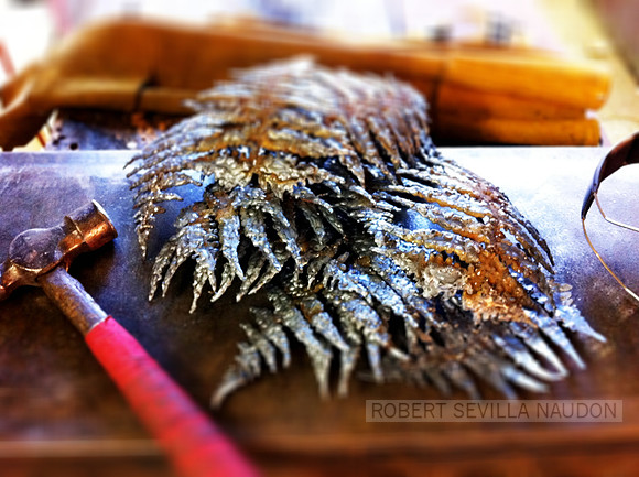 Stack of steel fern fronds